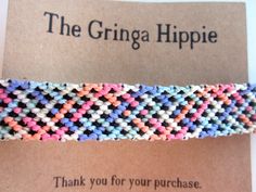 a close up of a bracelet on top of a card with the words, the grina hippie