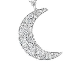 White gold moon pendant set with pave diamonds. . 18k white gold . 0.4 cts of pave diamonds . chain measures 26" Luxury White Gold Necklace With Moon Charm, Luxury White Gold Moon-shaped Jewelry, Silver Half Moon Diamond Jewelry, Luxury Silver Necklace With Moon Charm, Luxury White Gold Crescent Necklace, Luxury Crescent White Gold Necklace, Silver Crescent Diamond Necklace, Moon-shaped Diamond Necklace With Accents, Moon Shaped Diamond Necklace With Single Cut Diamonds