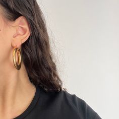 Gold hoops are an essential in one's jewelry collection - there is not a pair we come across that we don't love!These large-and-in-charge tube babies are a perfect example of this, giving you a chic and unique vibe that is a fun departure from normal wire hoops. They're hollow in make so super comfortable to wear on the lobes, easy to go from day to night. 14kt yellow gold 2.25" in diameter 6.6 grams in total weight Modern Tarnish Resistant Hoop Earrings, Modern Diamond Hoop Earrings For Everyday Luxury, Modern Everyday Luxury Hoop Earrings, Puffy Design, Modern Mens Rings, Art Jewelry Earrings, Antique Watches, Antique Engagement, Antique Engagement Rings