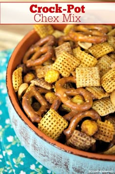 a bowl full of chex mix with the words crock - pot next to it