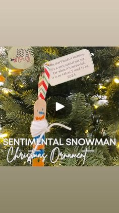 an ornament hanging from the top of a christmas tree that says sentimental snowman