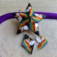 three pieces of bead art are arranged in the shape of a star