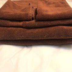 two brown towels folded on top of each other