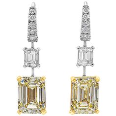 A vibrant pair of dangle earrings, showcasing GIA certified emerald cut yellow and white diamonds, set in 18K yellow gold and platinum mountings. The first yellow diamond is 5.31 carats with Fancy Light Yellow color and VS2 clarity, and the second yellow diamond is 5.01 carats with Y-Z color and SI1 clarity. The two emerald cut white diamonds weigh 1.41 carats total with D-VS1 and F-VVS2, respectively. Accented by round cut diamonds weighing 0.35 carat total. Roman Malakov is a custom house, spe White Diamond Dangle Earrings, Yellow Diamond Earrings, Yellow Diamond Earring, Fancy Light, White Diamond Earrings, Bling Earrings, Fancy Lights, Diamond Dangle Earrings, Expensive Jewelry