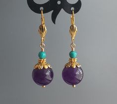 "Purple Jade Earrings Turquoise and Jade Earrings Round Eggplant colored Gemstone earrings Gold Plated Leverbacks Women Jewelry Length: approx. 42 mm 1 5/8\" Width: approx. 12mm 1/2\" Jade, Turquoise, Gold Plated Leverbacks" 1920s Jewellery, 1920s Jewelry, Gemstone Earrings Gold, Eggplant Color, Purple Jade, Earrings Round, Jade Earrings, Earrings Turquoise, Round Earrings