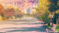 a park bench sitting on the side of a road next to trees and buildings in the background