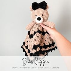 a crocheted teddy bear is being held by a woman's hand with the text below it