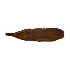 a wooden fish shaped dish on a white background