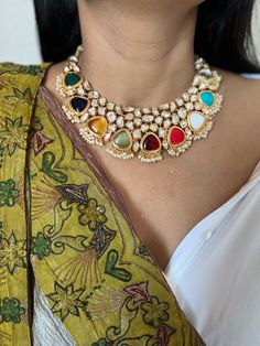 Be your own kind of beautiful. Simply a mark of royalty and elegance! You will definitely fall in love with the beautifully placed multicolored stones with Kundan Stone embellishments. One of our favorite picks for the wedding season ❤️ The pretty statement earrings add to the royalty of the stunning choker necklace. Length of earrings: 7 cms  Width of earrings: 3.3 cms Luxury Elegant Kundan Necklace With Cutdana, Luxury Blue Traditional Kundan Necklace, Elegant Multicolor Kundan Necklace, Elegant Multicolor Multi-stone Bridal Necklace, Elegant Multicolor Bridal Necklace For Festive Occasion, Elegant Multicolor Kundan Necklace For Celebrations, Elegant Multi-stone Kundan Necklace For Wedding, Multicolor Intricate Design Necklace For Wedding, Fusion Style Multicolor Bridal Necklace For Party