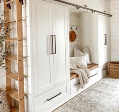 a room with white walls and wooden shelves