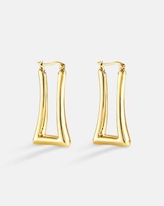 Beautifully elongated rectangular shape hoop earrings crafted in sterling silver plated over 18K yellow gold or white gold. The design has quite a lot of sharp edges, so it gives off an edgy and boxy type of vibe. Wearing an elongated hoop earrings can have the effects of scalping the face to make it look slimmer. The earrings are all hand polished and quality inspected to assure a luxurious finish. Luxury Rectangular Earrings, Earring Crafts, Earring Sale, Ear Jewelry, Shop Earrings, Statement Earrings, Jewelry Pieces, The Face, Gold Earrings