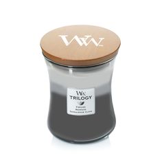 a black candle with a wooden lid and white lettering on the top, sitting in front of a white background