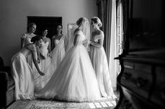 the bride and her bridesmaids are getting ready for their wedding