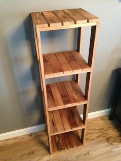 a wooden shelf sitting on top of a hard wood floor