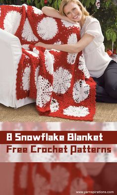 a woman sitting on a couch with a red and white crocheted blanket in front of her