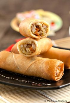 three chicken spring rolls stacked on top of each other