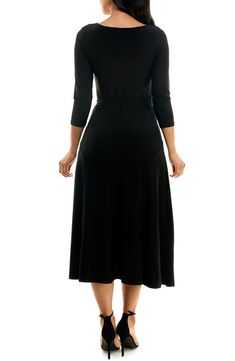 A twirl-worthy, tea-length skirt brings an elegant balance to a solid work-to-weekend dress fashioned from a stretch jersey for a sensible fit. 48" length Bateau neck Three-quarter length sleeves Waist belt 95% polyester, 5% spandex Machine wash, tumble dry Imported Model stats: 5'10" height, 32" bust, 25" waist, 36" hip. Model is wearing size Small. Black Stretch A-line Midi Dress, Stretch A-line Midi Dress For Work, Black Maxi Dress With Flattering Silhouette For Work, Fitted A-line Maxi Dress In Solid Color, Black A-line Midi Dress In Elastane, Midi Length Wrap Dress For Work, Solid Color Midi Wrap Dress For Work, Black Knee-length Elastane Midi Dress, Elastane Dress With 4-way Stretch