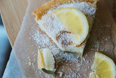 a slice of lemon cake with powdered sugar on top