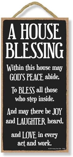 a house blessing sign hanging on a wall