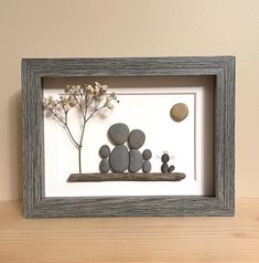 This Family of Four with Cat Pebble Art piece is made from gatherings our family has made from the shores of Lake Huron, Ontario, Canada.  The fully framed size is 6x8". It can stand on its own or hang on a wall. Each pebble art piece is constructed of authentic, quality materials, including: - hand-picked beach pebbles, - hand-selected beach driftwood, - hand-harvested plants which are then dried, - archival quality matte backboard, - archival quality surrounding matte, - wood frame with glass Lake Huron Ontario, Sea Glass Art Projects, Pebble Art Family, Beach Pebbles, Stones Art, Glass Art Projects, Sea Glass Beach, Moving Gifts, Lake Huron