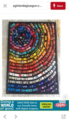 an art piece made out of cars is on display