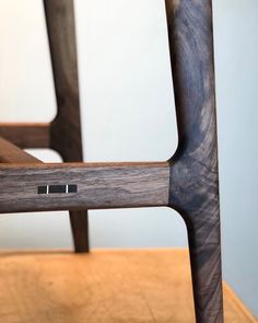 a close up of a wooden chair on a table