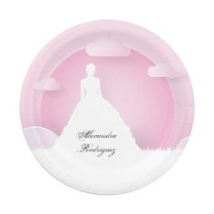 a paper plate with the silhouette of a woman in a wedding dress and clouds on it