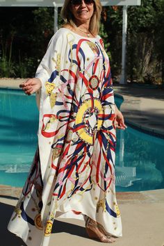 Designer print, summer-white silk caftan. Fun for home or away with its bright colors and lively print on a cool white background. One size. Fits small to X-large sizes. The width is 52 inches from edge to edge or 104 around the body. The length is 51 inches. The neckline is hand finished. Summer Dresses With Digital Print And Kimono Sleeves, White Floral Print Kaftan For Beach Cover-up, White Bohemian Kaftan For Spring, Printed White Tunic Dress, White Tunic Kaftan For Summer, White Summer Tunic Kaftan, White Printed Tunic Dress, Beach Dresses With Digital Print And Kimono Sleeves, White Silk Kaftan For Spring