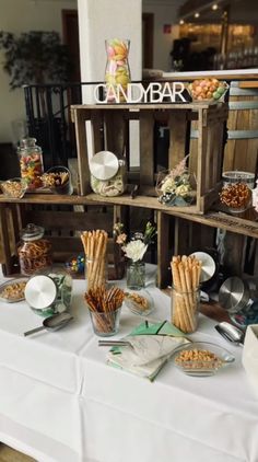 the table is set up with snacks and desserts