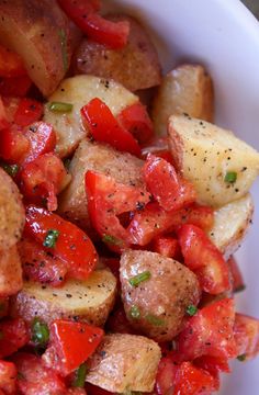 potatoes and tomatoes are mixed together in a dish