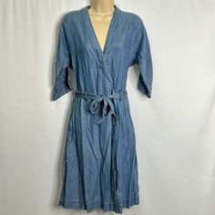 New Condition. Length: 40.5 In Pit To Pit: Approximately 18 In Please Review All Photos And Ask Questions If You’ve Got Them Prior To Purchasing! Casual Cotton V-neck Wrap Dress, Summer Workwear Indigo Dress, Indigo Dresses For Summer Workwear, Blue Tie Waist Wrap Dress For Spring, Spring Blue Wrap Dress With Tie Waist, Blue Wrap Dress With Tie Waist For Spring, Casual Belted Knee-length Wrap Dress, Casual Belted Wrap Dress For Day Out, Spring Cotton Wrap Dress With Tie Waist