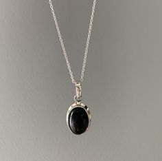 Sterling silver oval black onyx necklace Gift box available for purchase. Search GIFTBOX Formal Onyx Oval Necklace, Classic Oval Onyx Necklaces, Black Onyx Oval Pendant Necklace, Black Oval Pendant Minimalist Jewelry, Black Oval Pendant Necklace For Gift, Minimalist Black Oval Pendant Jewelry, Gift Oval Cabochon Necklace With Polished Finish, Silver Oval Onyx Necklace, Onyx Oval Pendant Jewelry For Gift