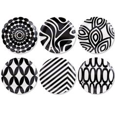 six black and white plates with circular designs on the front, one has an abstract design