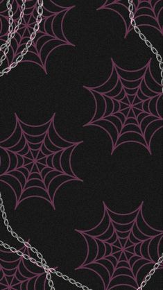 a black background with pink and silver spider webs on the bottom, along with white chains