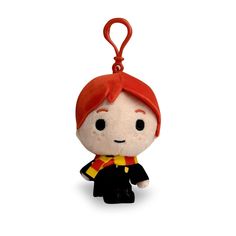 a small stuffed toy with a red hair