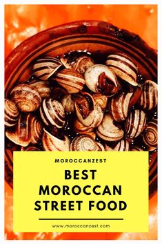 a bowl filled with lots of different types of food next to a yellow sign that says best moroccan street food