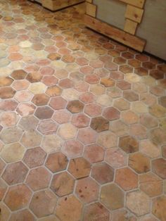 a bathroom floor that has been cleaned and is in need of some work to be done