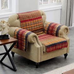 a living room with a chair and table