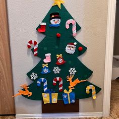 a christmas tree made out of paper and magnets