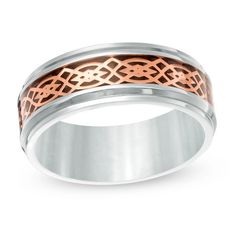 Romantic and refined, this wedding band is a gift that honors him on your special day. Crafted in stainless steel, this dramatic 8.0mm-wide design features a black carbon fiber inlay beneath a rose ion-plated Celtic pattern at its center. Stepped edges complete this detailed style. Buffed to a brilliant luster, this comfort-fit wedding band is sure to be cherished. Custom-made to fit his ring size. Stainless steel bands cannot be resized after purchase. Zales Zales, Men's Wedding Bands, Comfort Fit Wedding Band, Pattern Wedding, Celtic Patterns, Size 10 Rings, Stainless Steel Band, Mens Wedding Bands, Wedding Ring Bands