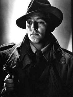 black and white photograph of a man wearing a hat