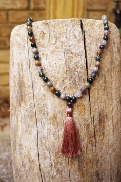 "- Rose Quartz Mala, Agate Mala, 108 Knotted Mala, Buddhist Jewelry, Boho Necklace, Tassel Bead Necklace, Tassel Mala, Chakra Mala - FREE SHIPPING This listing is for ONE mala necklace. This healing mala necklace features 108 beads of Indian Agate and Rose Quartz. Each necklace is created by hand, and is available in a hand-knotted or non-knotted version. These necklaces can also be used as wrapped bracelets. This mala is available in both 6mm and 8mm beads, and is either knotted with a beautifu Spiritual Tassel Necklace With 108 Round Beads, Multicolor Hand Knotted Beaded Necklaces For Meditation, Agate Jewelry Necklace, Rose Quartz Mala, Buddhist Jewellery, Necklaces Beaded, Beads Mala, Indian Agate, Necklace Indian