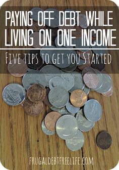 a pile of coins with the words paying off debt while living on one income five tips to get you started