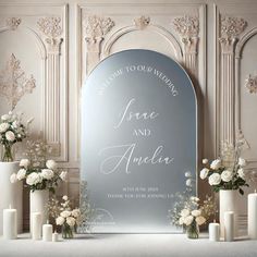 a mirror with flowers and candles in front of it that says welcome to our wedding