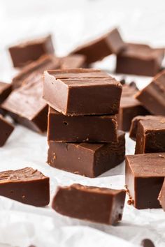 a pile of chocolate pieces sitting on top of white paper