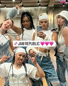 the girls are posing together in front of a cell phone and wearing headbands