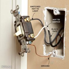 an electrical outlet in the wall with wiring attached to it and two switches on each side