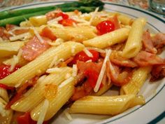 pasta with ham, cheese and asparagus on a plate