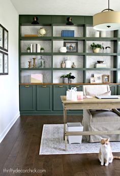 a living room filled with lots of furniture and bookshelves on top of shelves