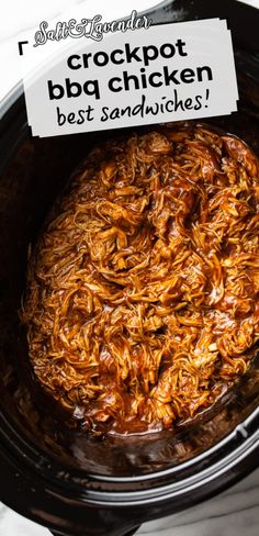 crockpot bba chicken in the slow cooker with a sign that says best sandwiches